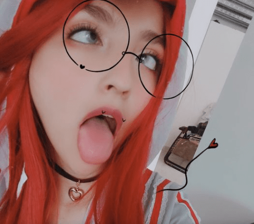 Redhead girl ahegao face with glasses and necklace